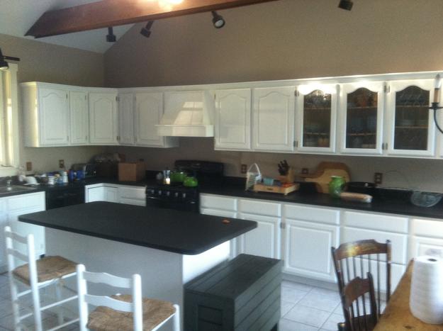 White cabinets in a large kitchen with an island